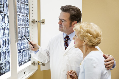 A doctor explaining an Xray to a patient