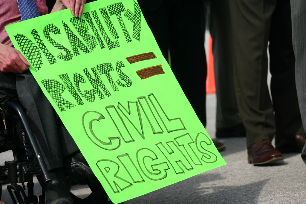 Sign stating, "disability rights = civil rights," from a disability rights protest.