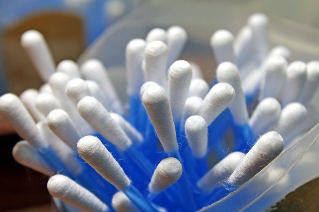 A container is filled with cotton swabs.