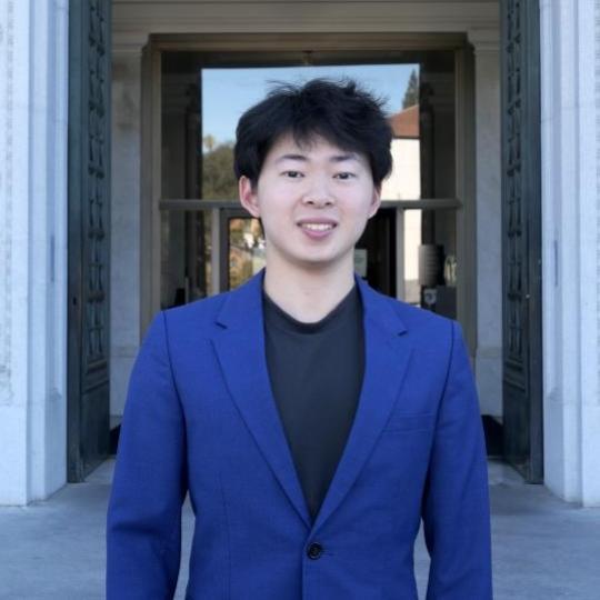 headshot of Sean Wang