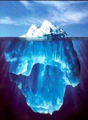 An iceberg is shown floating above water. Below water, there is a larger ice mass.
