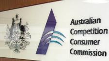 Logo of  Australian Competition and Consumer Commission (ACCC) located on wall of office.