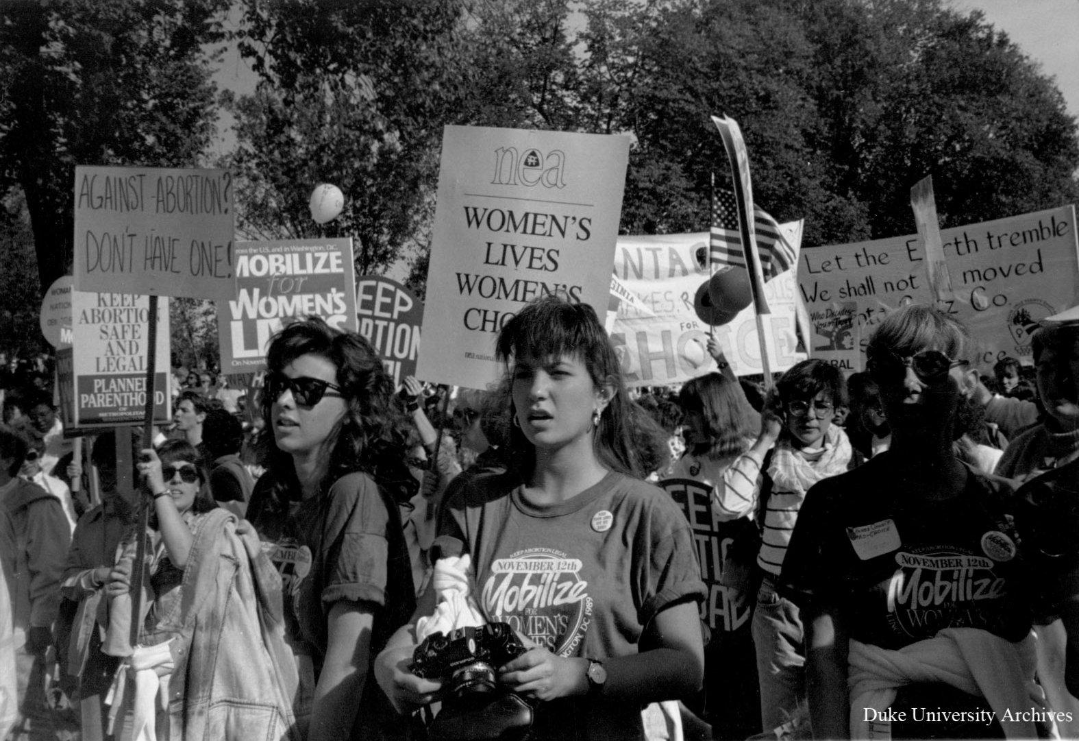 Black and white image of a women's rights demonstration related to reproductive health