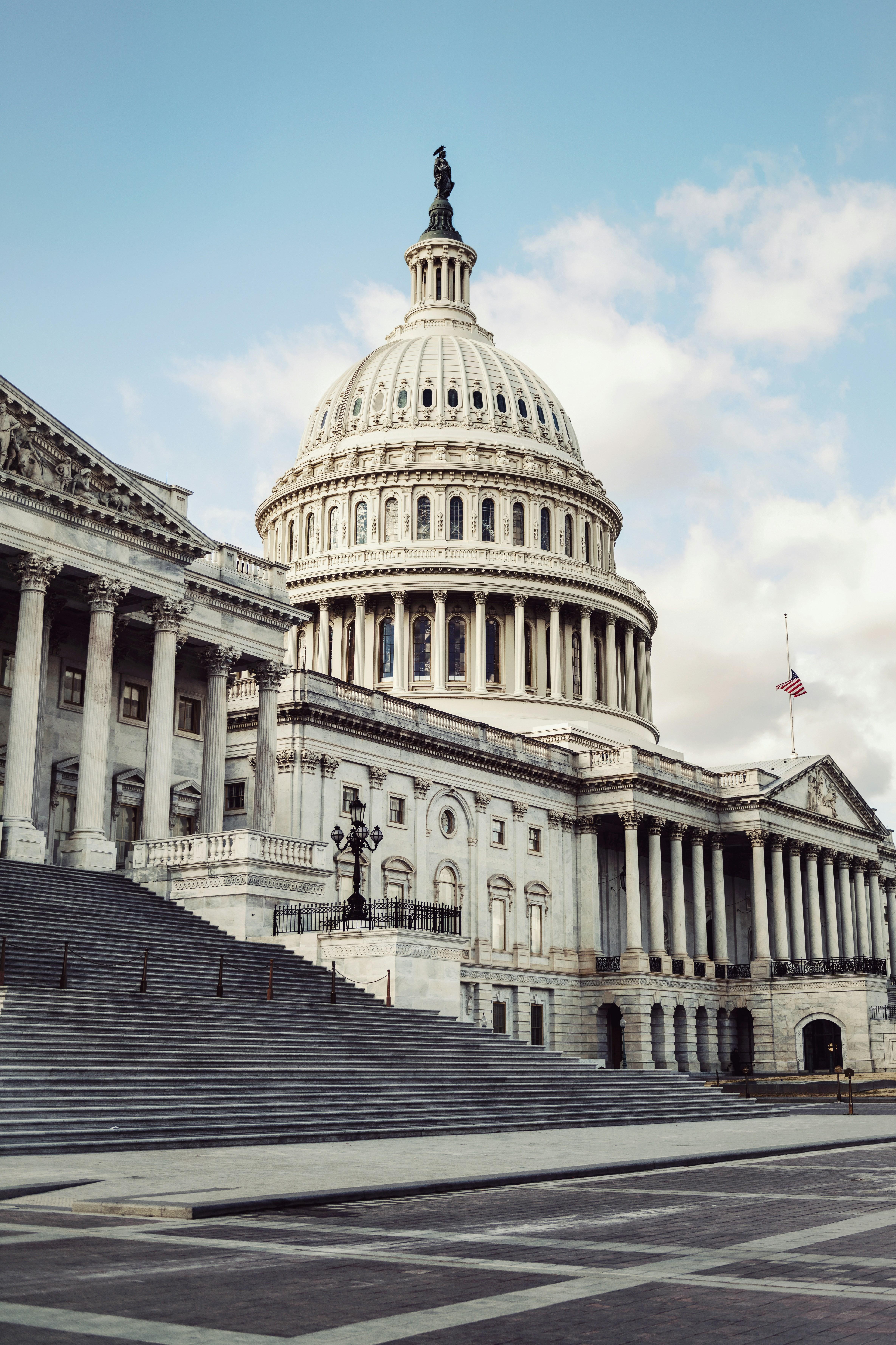 US Capitol Building with blue sky and clouds in the background