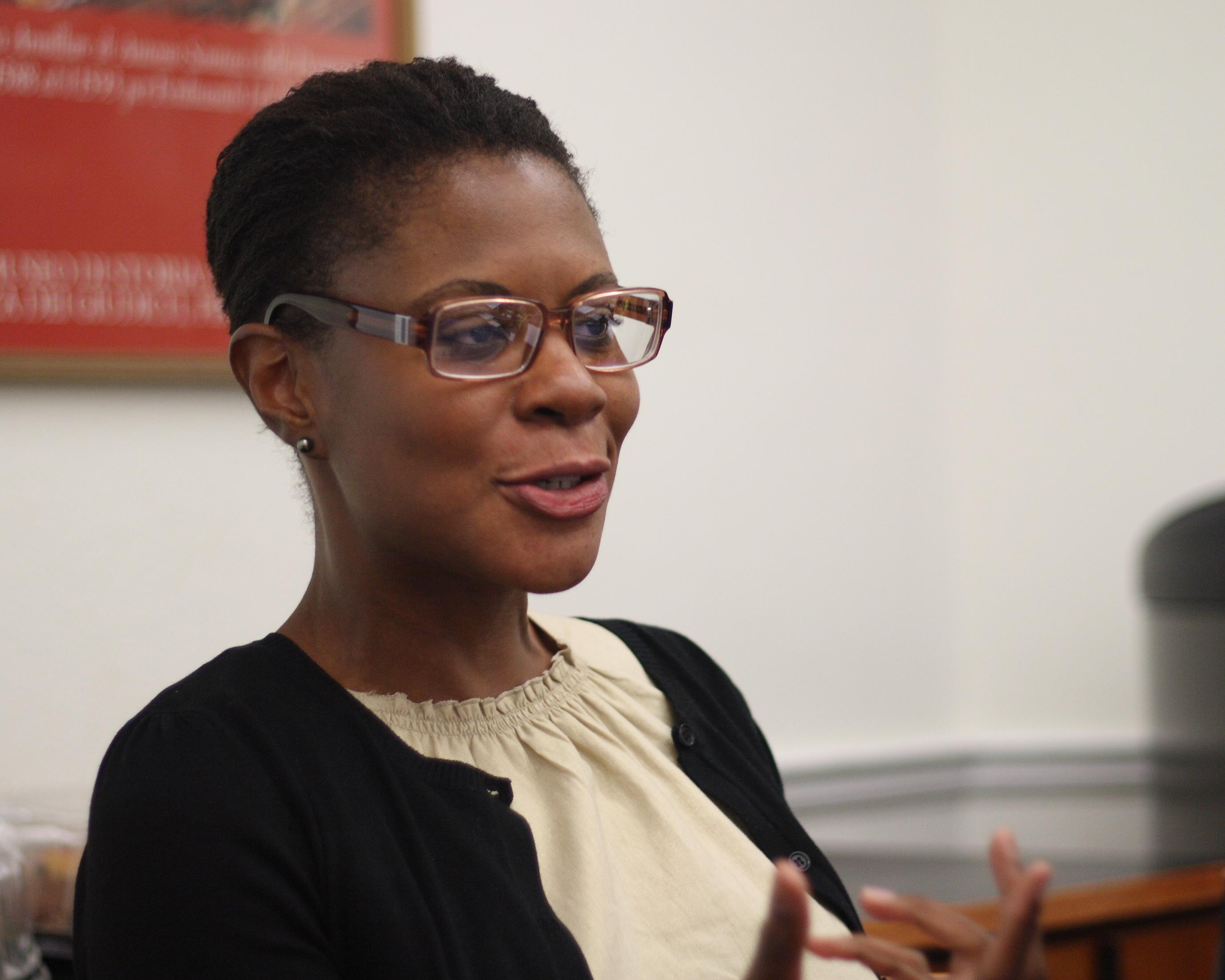 Portrait of Alondra Nelson deeply engaged at a speaking event.