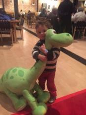 My son hugs a stuffed dino. (Kachine Blackwell, used with permission.)