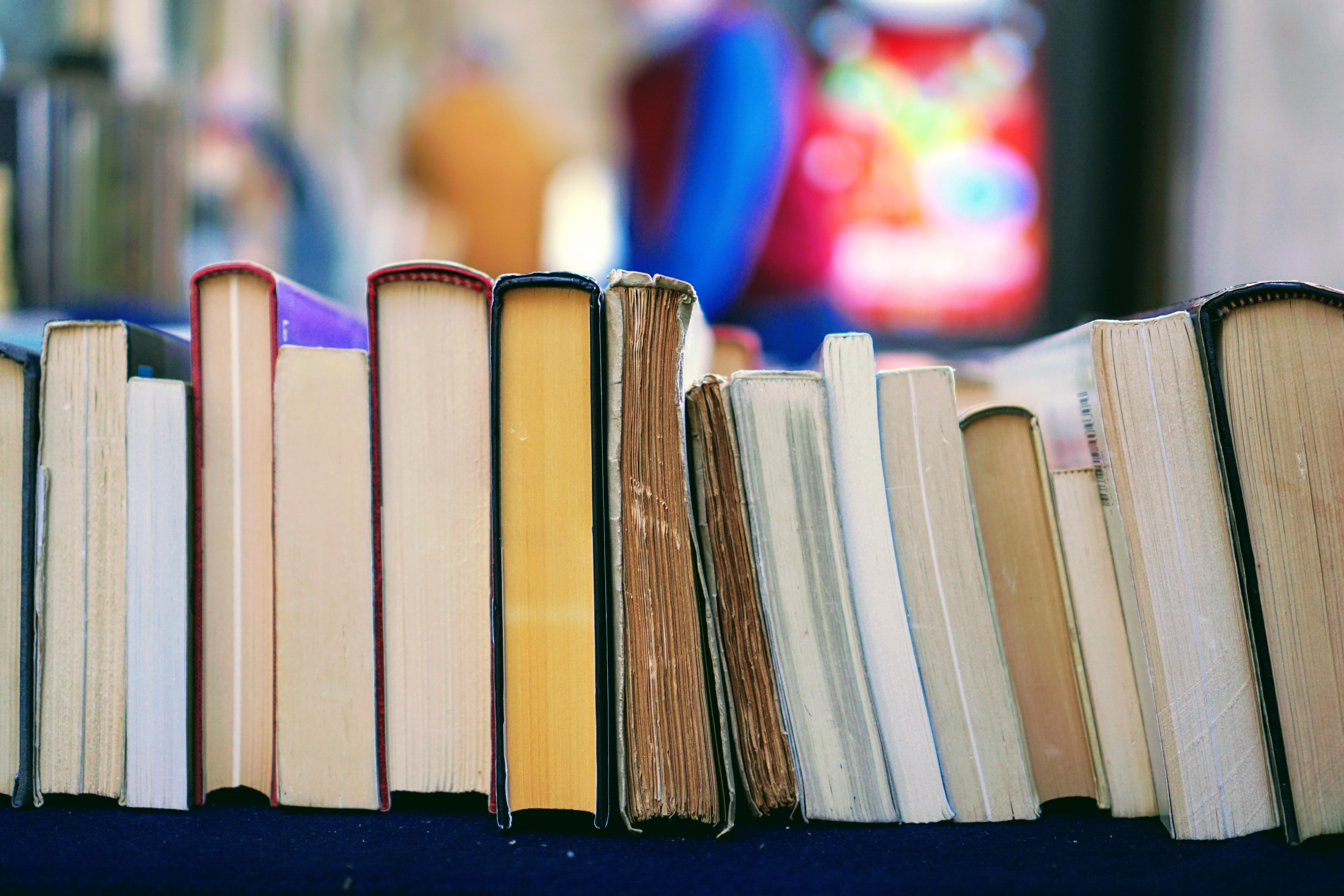 books arranged spine up on a table