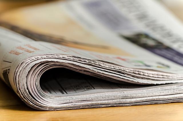 a folded newspaper, viewed from the side