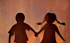 Burnt orange background with a shadow of two children holding hands. There is a boy on the left and a girl with pigtails on the right.